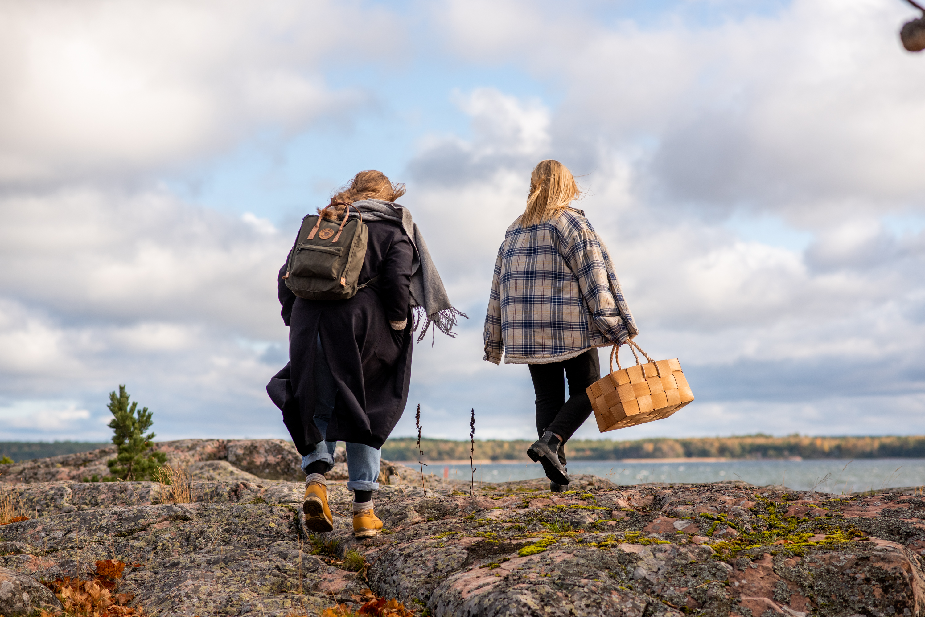 Two women foraging in Finnish coast